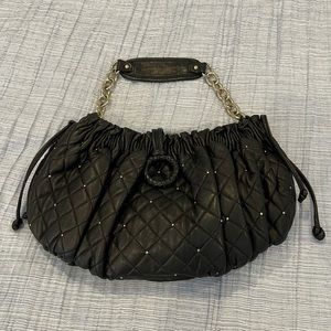 BCBG black and gold quilted leather bag.